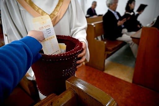 Tithing / giving a tithe of 10% of ones wages is not in the Bible